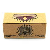 Medusa Filters Unbleached Rolls King Size Slim, Frontansicht, braune Kraftpapier-Verpackung, schwarzes Medusa-Logo mit Schlangenhaaren, Aufschriften „Unbleached Rolls" und „King Size Slim", lila Pfeil in Sichtfenster