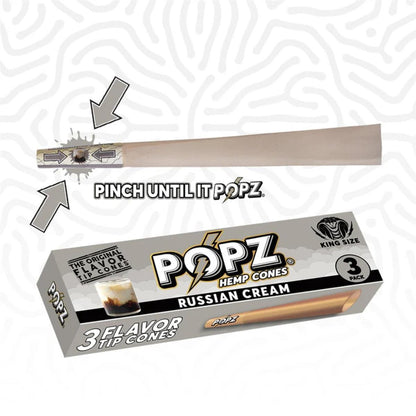 Popz Hemp Cones Russian Cream King Size – graue Verpackung mit 3 Flavor Tip Cones und Cocktailglas-Illustration, darüber ein Cone mit Anleitung "Pinch Until It Popz" und Pfeilen die zeigen wo der Flavor Tip zusammengedrückt werden soll